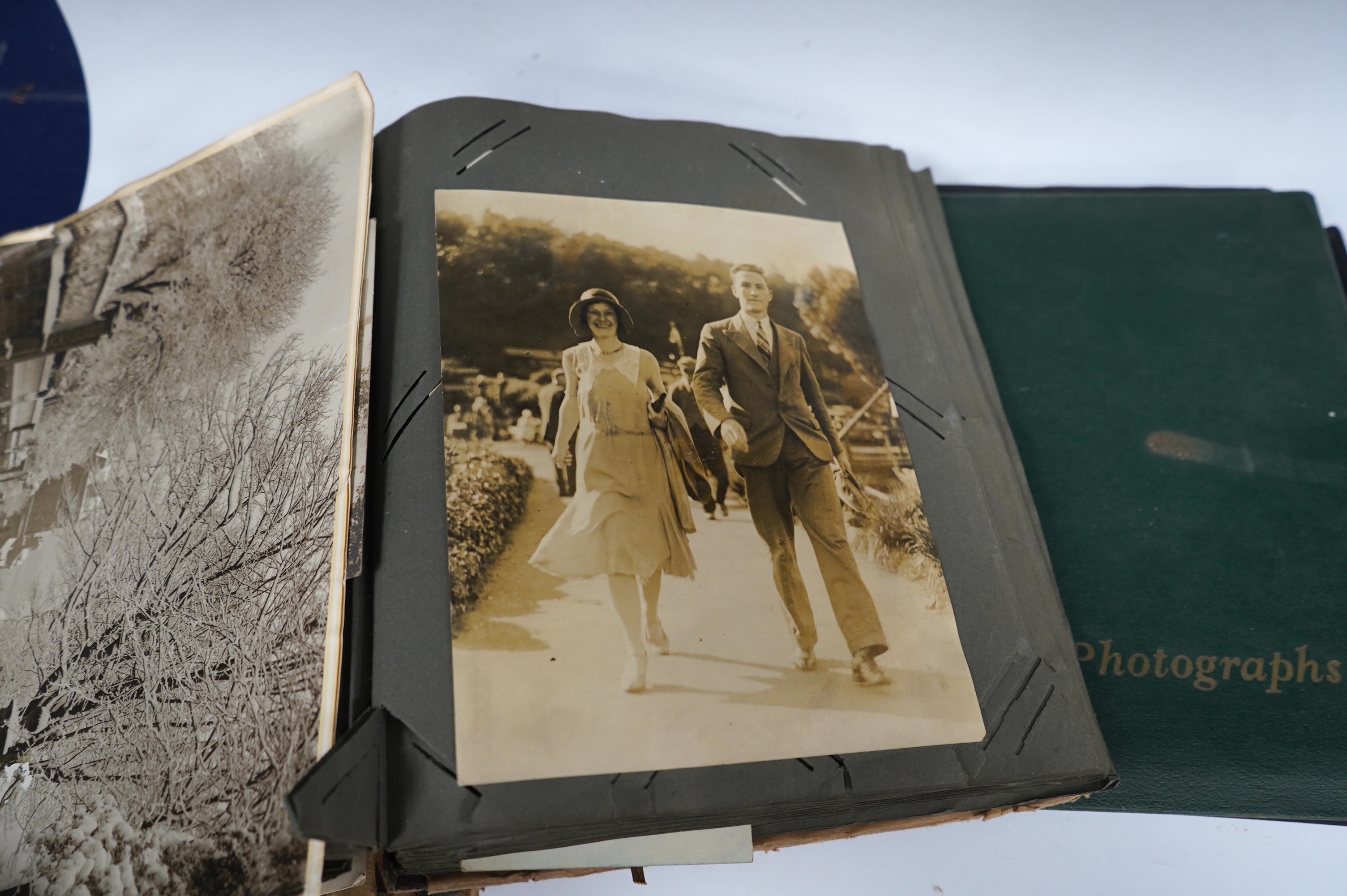Two 1940s family photograph albums, including a few 1930s postcards, two photos of RAF aircraft, as well as military photographs of soldiers in uniform, etc. Condition - poor to fair